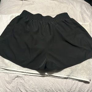 Blooming jelly brand black lined shorts size medium with zippered back pocket